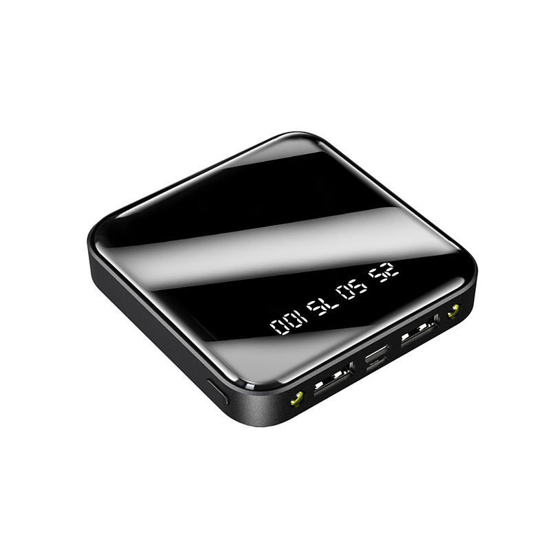 Black electronic device with digital display on a white background