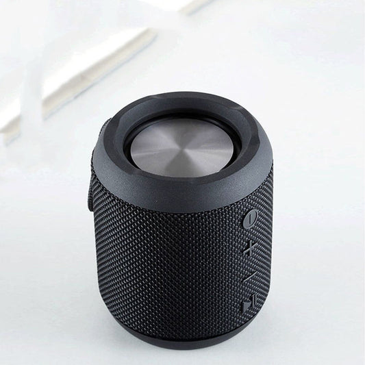 Black textured Bluetooth speaker on a white background