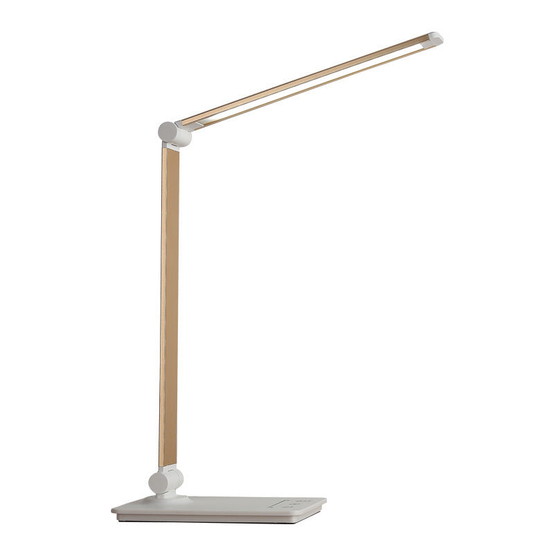 Modern desk lamp with wooden arm and white base on a white background