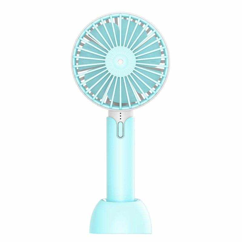 Portable mini handheld desktop fan in light blue, silent and electric, ideal for workspace use.